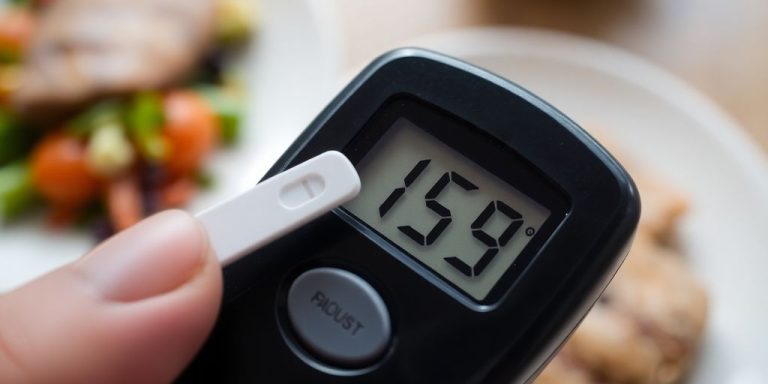 Blood sugar meter, finger prick, healthy food.